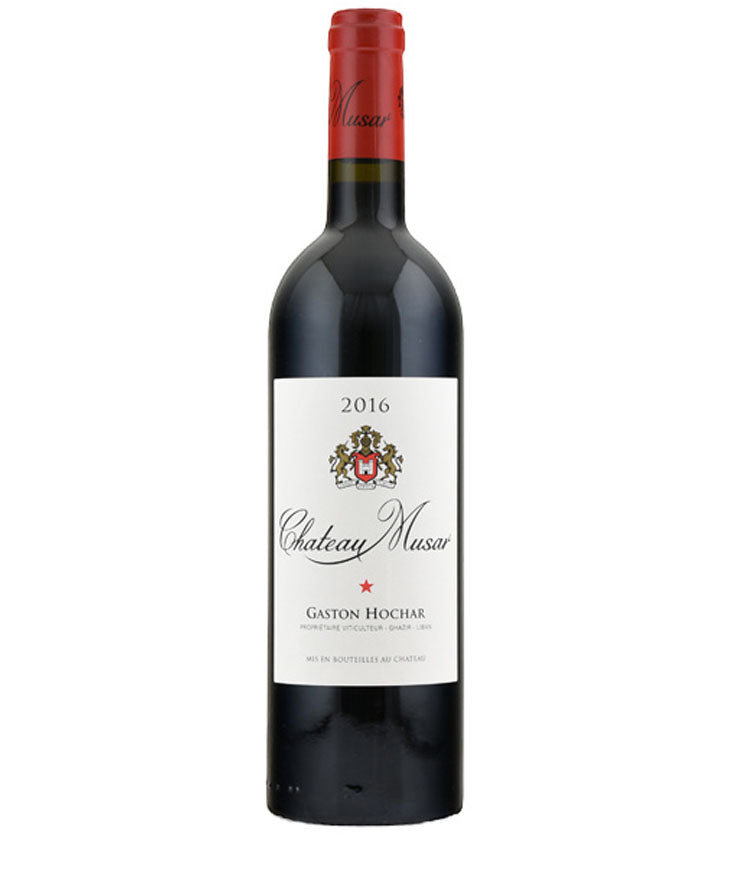Bottle of Chateau Musar Red 2016 wine with red foil capsule and cream label featuring the winery crest and the name Gaston Hochar.