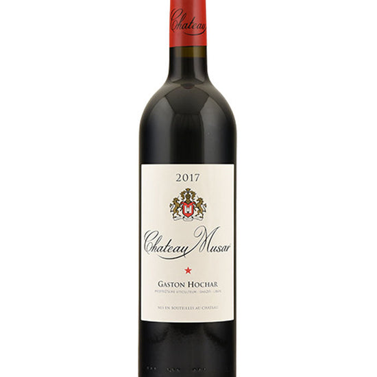 Bottle of Chateau Musar Red 2017 wine with red foil capsule and cream label featuring the winery crest and the name Gaston Hochar.