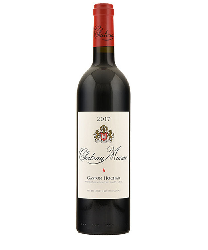 Bottle of Chateau Musar Red 2017 wine with red foil capsule and cream label featuring the winery crest and the name Gaston Hochar.