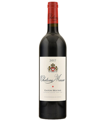 Bottle of Chateau Musar Red 2017 wine with red foil capsule and cream label featuring the winery crest and the name Gaston Hochar.