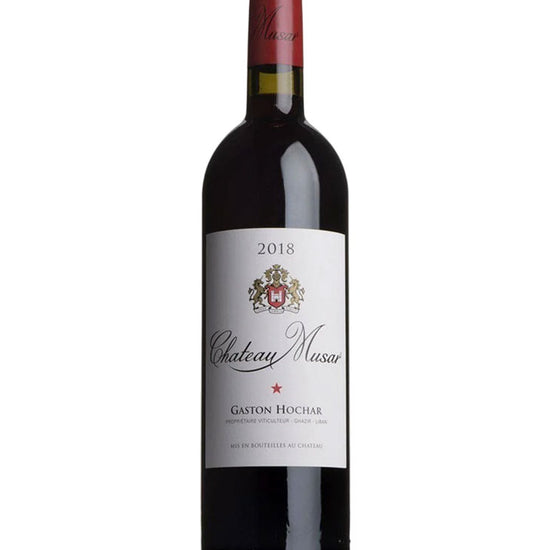 Bottle of Chateau Musar Red 2018 wine with red foil capsule and cream label featuring the winery crest and the name Gaston Hochar.