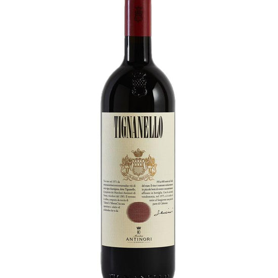 Red wine bottle with Tignanello label on a white background