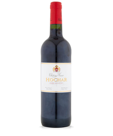 Red wine bottle with a red cap and visible label on a white background