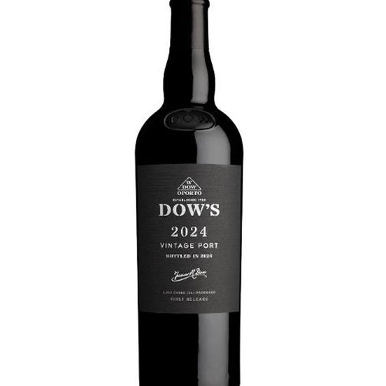 A bottle of Dow's 2024 Vintage Port in 2024, featuring a dark glass bottle with a black label and white text, set against a plain white background.