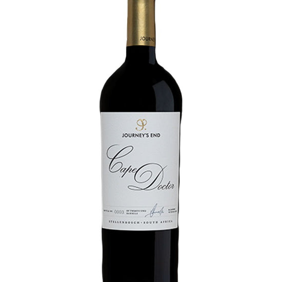 A bottle of Journey's End Cape Doctor red wine, featuring a dark glass bottle with a gold foil capsule and a white label with elegant black script.