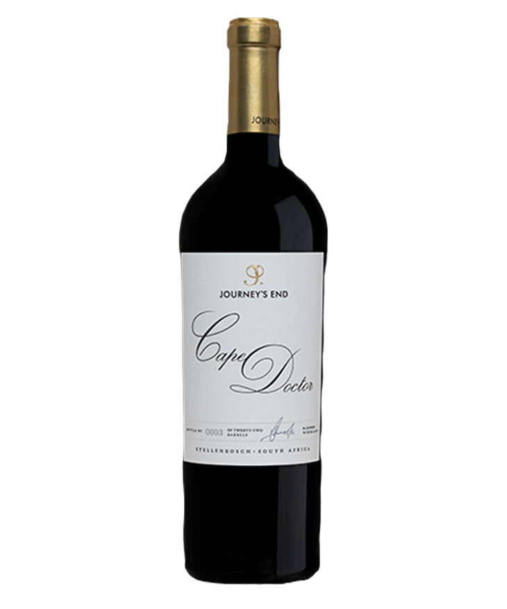 A bottle of Journey's End Cape Doctor red wine, featuring a dark glass bottle with a gold foil capsule and a white label with elegant black script.
