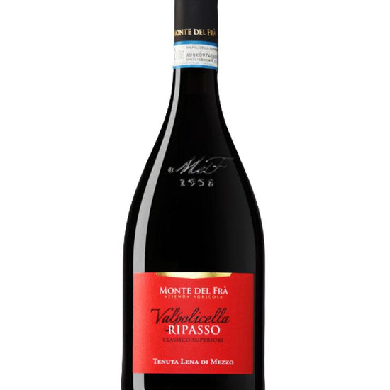 Wine bottle with red label on a white background