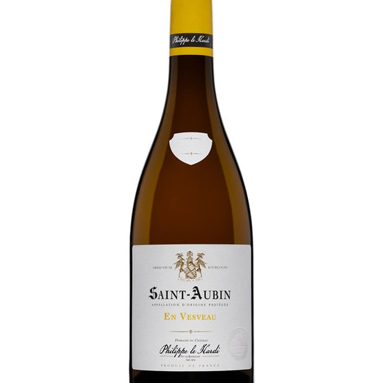 Wine bottle with yellow cap and white label on a white background
