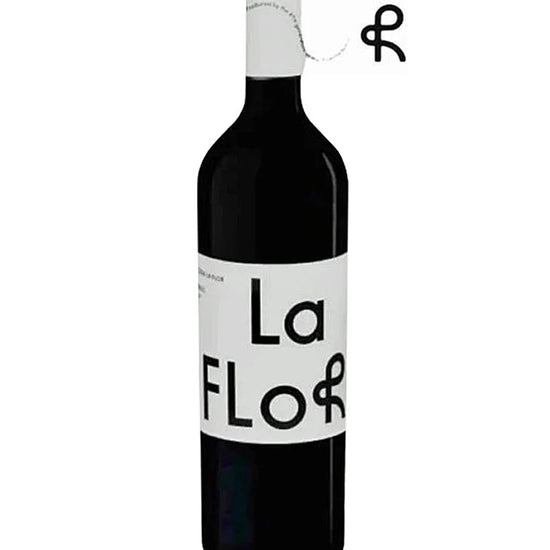Bottle of Pulenta Estate La Flor Malbec 2023 with a white label featuring bold black typography.