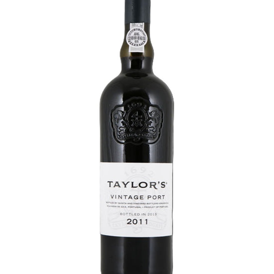 A bottle of Taylor's Vintage Port 2011 wine, featuring a dark glass bottle with a black capsule and a white label, set against a plain white background.