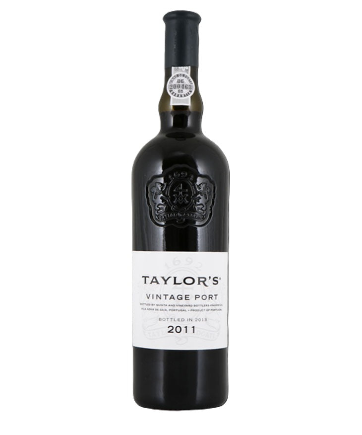A bottle of Taylor's Vintage Port 2011 wine, featuring a dark glass bottle with a black capsule and a white label, set against a plain white background.