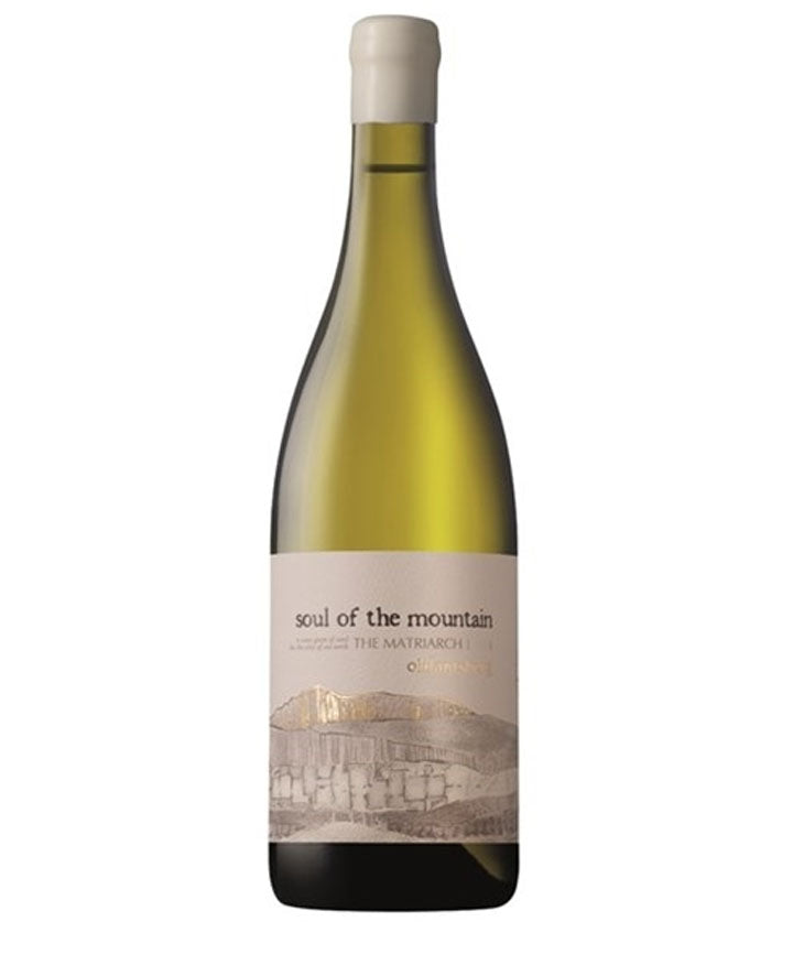 A bottle of Soul of the Mountain, The Matrirach featuring a pale green glass bottle, a cream-colored label with a minimalist mountain illustration, and a white capsule cap, set against a plain white background.