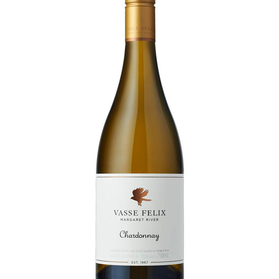 A bottle of Vasse Felix Margaret River Chardonnay white wine, featuring a gold foil-wrapped neck, a dark green glass bottle, and a white label with a brown bird logo.