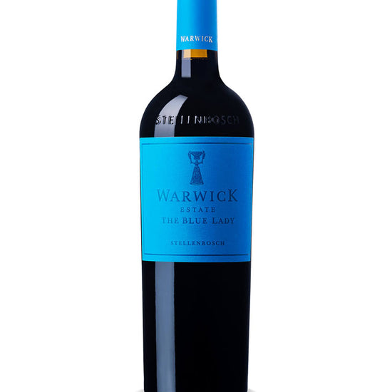 A bottle of Warwick The Blue Lady red wine, featuring a bright blue label and matching blue foil on the neck, set against a plain white background.