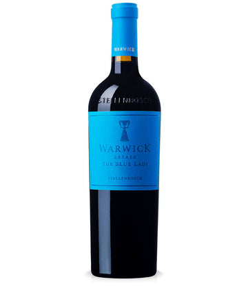 A bottle of Warwick The Blue Lady red wine, featuring a bright blue label and matching blue foil on the neck, set against a plain white background.